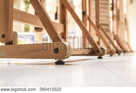 Row Of Easels Used For Display Finished Paintings. Selective Focus