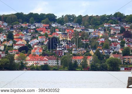 Swedish Residential Architecture. Lakeside Colorful Homes By Lake Vattern In Jonkoping, Sweden.