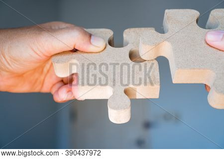 Businesswoman Hand Of Teamwork Holding Jigsaw Puzzle Connecting, Business Team Work Of Solutions In 