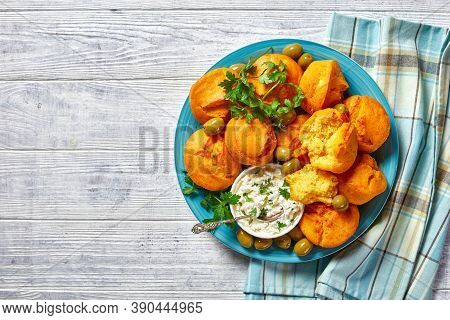 Southern Cuisine: Gluten-free Corn Muffins Of Cornmeal, Yogurt, And Eggs Served On A Blue Plate With