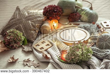 Autumn Composition Of Pumpkins, Hydrangea Flowers, Home Decor Details With Candles And A Gerland On 
