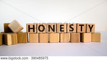 Honesty Word Written On Wood Cubes. Honesty Text On Table, Business Concept. Beautiful White Backgro