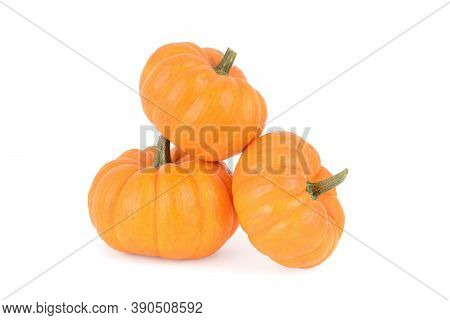 3 Pumpkins In A Pile Isolated White Background Fall And Halloween Concept