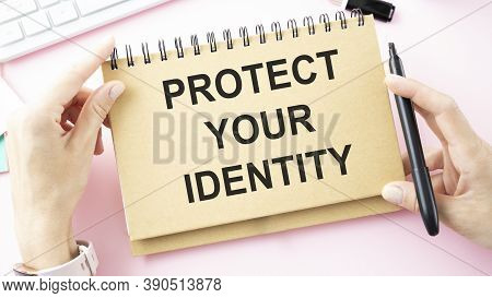 Desktop With Documents, Calculator And Notebook. On A Blockboard Inscription Protect Your Identity