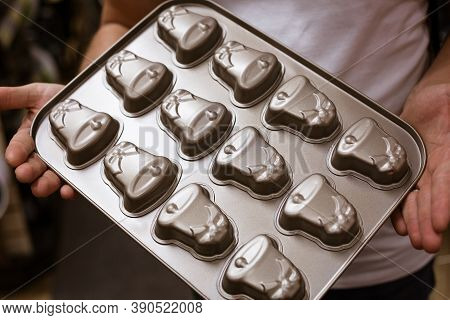 Iron Cake For Cookies And Gingerbread In The Hands Of A Man