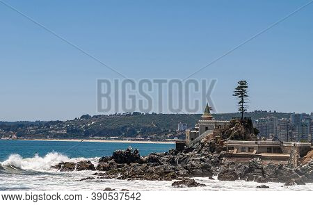 Vina Del Mar, Chile - December 8, 2008: Wulff Castle With Tower On Rocks In Sur..  Green Dark Coastl