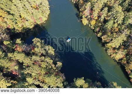 Aerial View Of Pontoon Boat On Lake Santeetlah, North Carolina In Autumn.