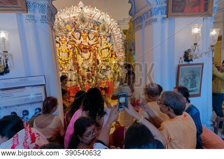 Kolkata, West Bengal, India - 6th October 2019 : Devotee Woman Taking Picture Of Traditionally Decor