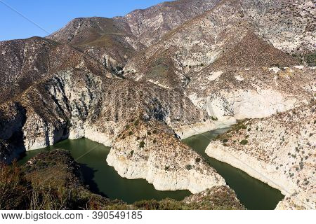 Reservoir With Low Water Levels During A Prolonged Drought Surrounded By The Arid San Gabriel Mounta