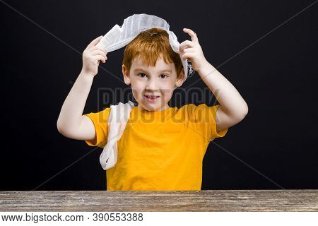 A Beautiful Boy With Red Hair With A Damaged Head Bandages Himself With A Medical Bandage, A Boy Wit