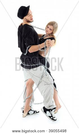 Rapper wearing black t-shirt graceful girl dance twisted with chains isolated on white background.