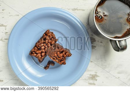 Cracker And Coffee On The Wooden Chopping Board On The Table