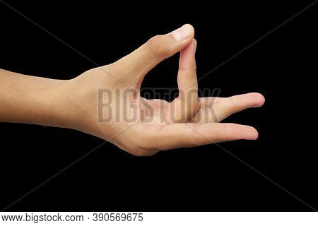 Shot Of A Male Hand Demonstrating Aakash Mudra Isolated On Black Background.