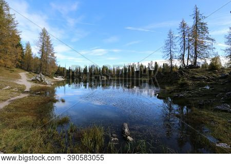 Autumn In The Dolomites, View Of Federa Lake Surrounded By Mountains. High Quality Photo