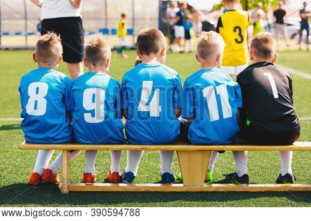 Football Soccer Game For School Boys. Children Substitute Players In A Sports Team In Jersey Shirts 
