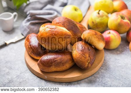 Ready-made Baked Pies (pirogi) With Apple. Traditional Russian Cuisine.ready-made Baked Pies (pirogi