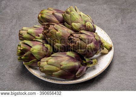 Fresh French Petit Violet Artichokes Heads Cultivted In Brittany, France