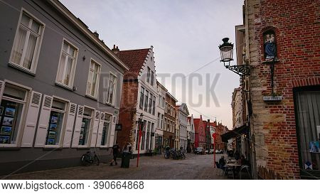 Bruges, Belgium - May 12, 2018:  Roofs And Windows Of Old Authentic Brick Houses On Street Sint-jako