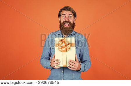 Happy Bearded Man With Present Box. Cheerful Brutal Hipster Hold Gift. Boxing Day. Birthday Surprise