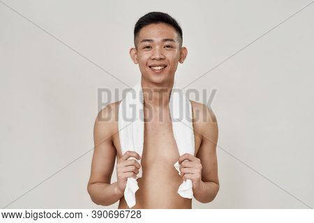 Portrait Of Shirtless Young Asian Man With Problematic Skin And Hyperpigmentation On His Face Posing