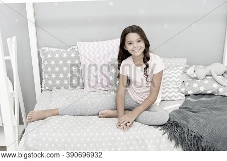 Cute And Adorable. Little Girl Relax On Bed. Happy Little Girl. Childhood Years. One Of The Luckiest
