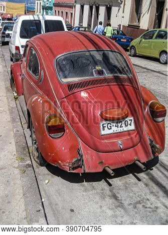 Valparaiso, Chile - December 8, 2008: Lower Class Neighborhood Street With Old, Red, Delapidated Vw 