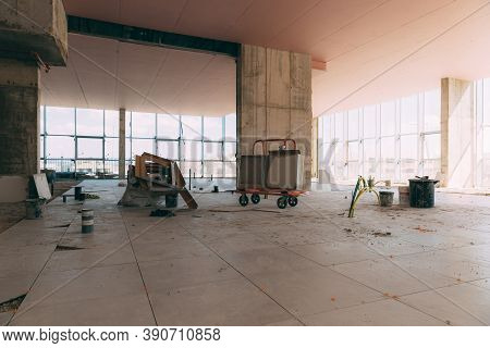 Construction Site Of A Shopping Center Inside. Construction Accessories, Carts, Paint, Electrical Wi