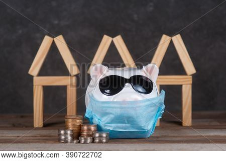 Pandemic Real Estate Crisis. Masked Piggy Bank