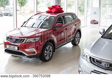Russia, Izhevsk - August 14, 2020: New Modern Cars Atlas In The Geely Showroom. Front And Side View.