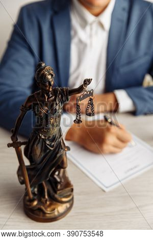 Lawyer Office. Statue Of Justice With Scales And Lawyer Sighning A Document. Legal Law, Advice And J