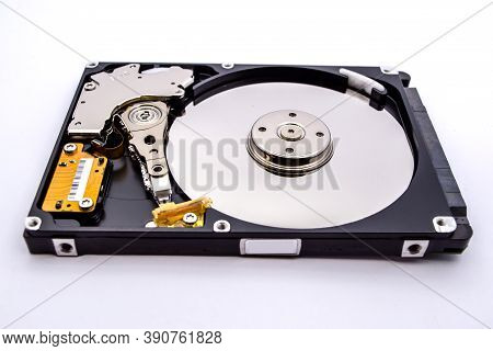 Internal Parts Of A Hard Disk Isolated On A White Background. Close Up Of Hard Disk Drive Inside Vie