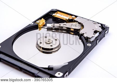 Internal Parts Of A Hard Disk Isolated On A White Background. Close Up Of Hard Disk Drive Inside Vie