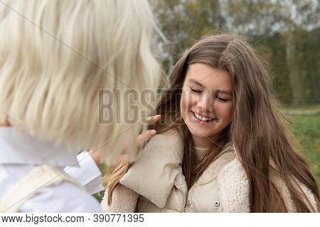Close Up Portrait Of Mother And Daughter Outside. Happy Moments Of Communication, Smiles. Healthy Fa