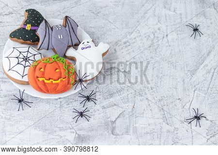 Delicious Halloween Cookies On White Textured Concrete. Halloween Gigger Cookies On Textured Concret