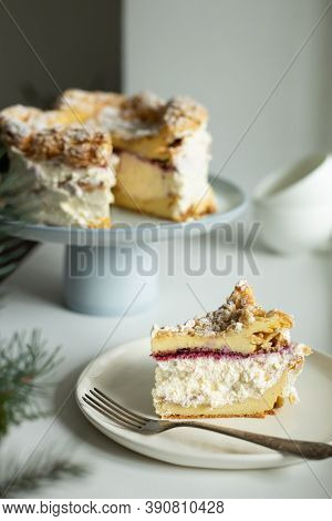 Polish Carpathian Mountain Cream Cake On Blue Ceramic Cake Stand. A Piece Of Cake On The Plate. Home