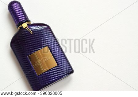 Tom Ford Velvet Orchid Fragrance Perfume Bottle Lies On Light Lilac Background. Tom Ford Is American