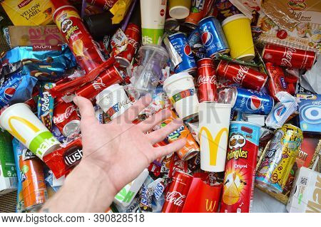 Many Wrappings And Cans From Used Products By Famous Worldwide Brands. Pattern Of Trash Of Various C
