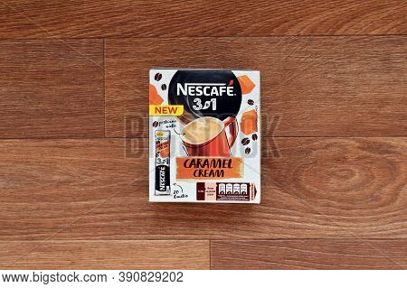 Nescafe Caramel Cream Coffee Sticks Box On Wooden Background. Nescafe Is A Brand Of Coffee Made By N