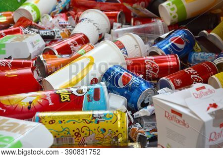 Many Wrappings And Cans From Used Products By Famous Worldwide Brands. Pattern Of Trash Of Various C
