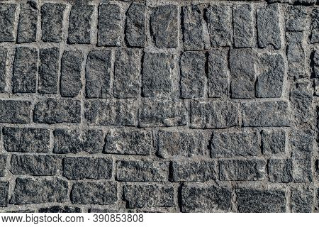 Old Paving Stone Mosaic Pattern. Pavement Texture. Gray Cobblestone Sidewalk Background. Rough Grani