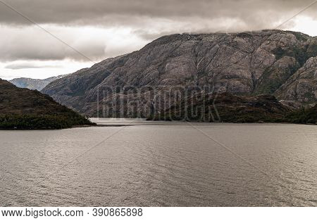 Sarmiento Channel, Chile - December 11, 2008: Amalia Glacier And Fjord. Cloudscape Covers Top Of Mou