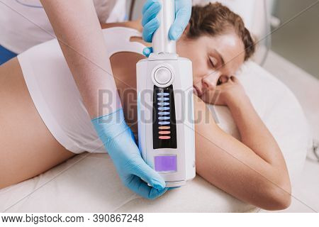 Cropped Shot Of A Woman Enjoying Endospheres Therapy Massage By Professional Dermatologist. Beautici