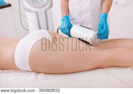 Cropped Shot Of A Woman Receiving Endospheres Massage On Her Thighs At Beauty Clinic