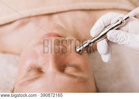 Close Up Shot Of A Man Getting Skincare Facial Treatment At Beauty Clinic