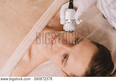 Top View Close Up Of A Handsome Cheerful Man Having Skin Firming Facial Procedure At Cosmetology Sal