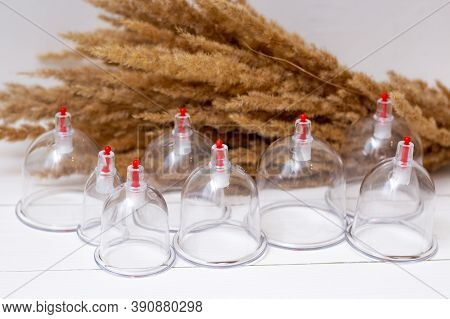 Hijama Jars And Pump On A White Wooden Background. Bloodletting. Sunnah Treatment. Islam. Ears Of Co