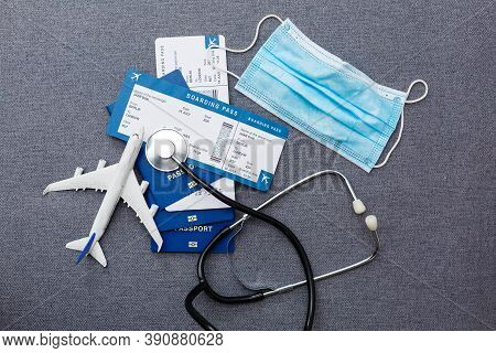 Coronavirus And Travel Concept. The Concept Of Restrictions For Tourism. Passport, Thermomether And 