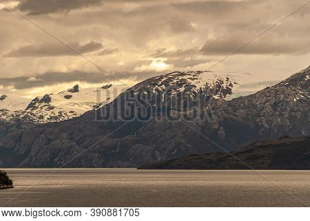 Sarmiento Channel, Chile - December 11, 2008: Amalia Glacier And Fjord. Snow On Mountain Ramge Under