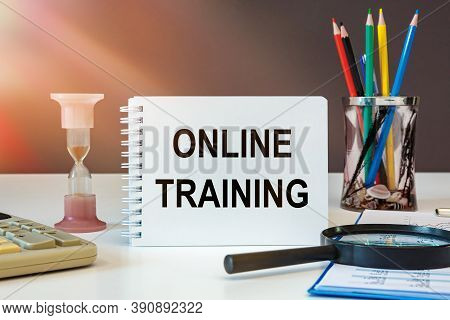 Desktop With Documents, Calculator And Notebook. On A Blockboard Inscription Online Training