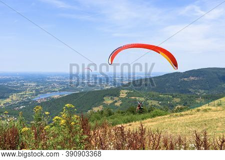 Paragliders Start Their Flight On Zar Mountain Near Zywiec In Southern Poland